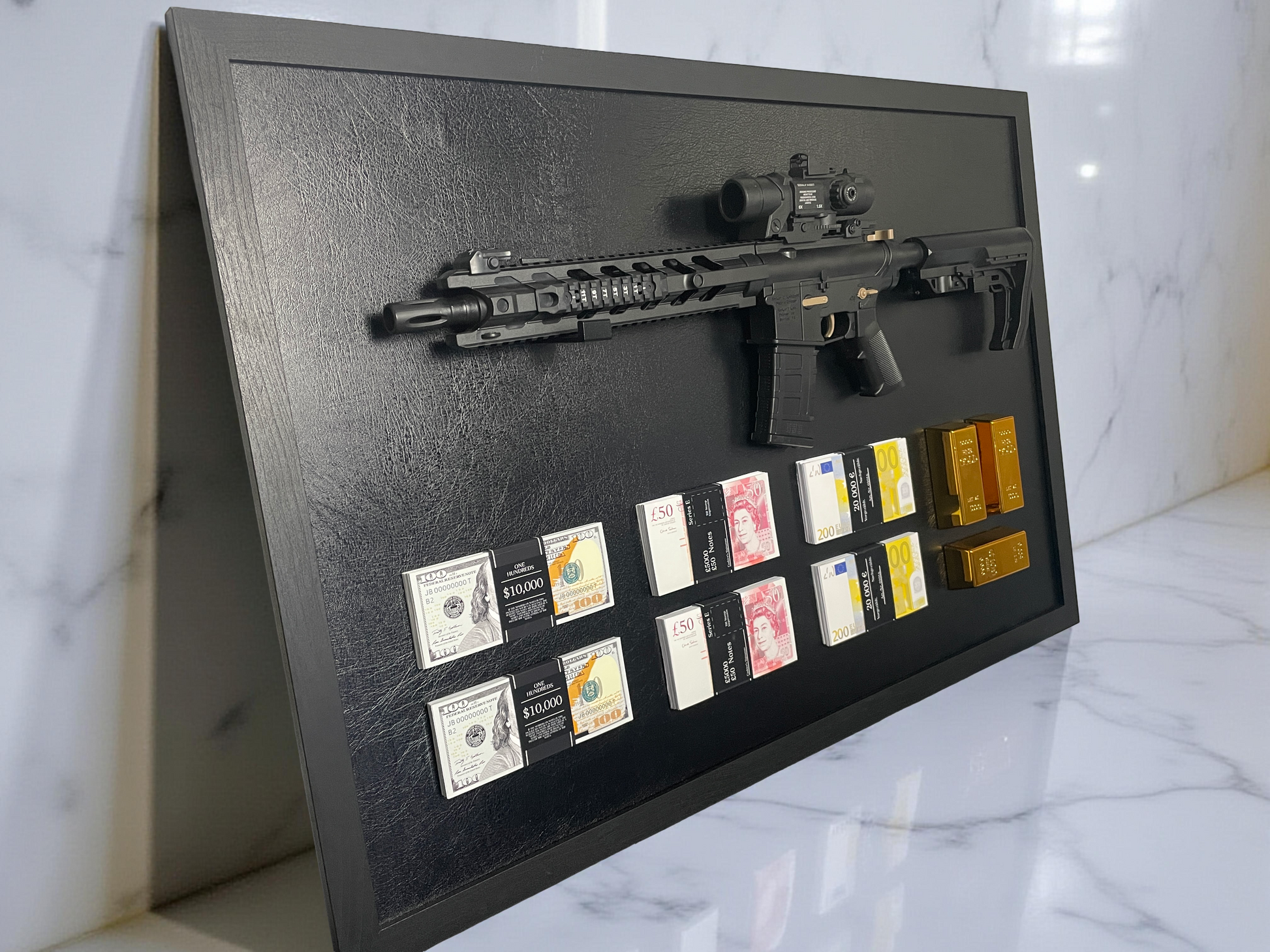 A framed display featuring a rifle, stacks of USD, GBP, and EUR currencies, and three gold bars.