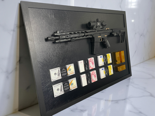 A framed display featuring a rifle, stacks of USD, GBP, and EUR currencies, and three gold bars.
